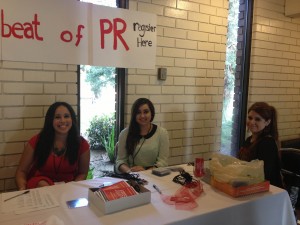 Fresno State PRSSA members and regional conference volunteers Sarina Hernandez, Yocelin Gallardo and Juana Piceno registering attendees as they arrive for the event's welcome dinner.  Image courtesy of Reginae Smith-Love