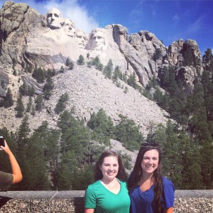 Past National Committee members Heather Harder and Victoria Lewis in front of Mt. Rushmore. Photo courtesy of Heather Harder.
